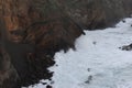 Waves breaking on the rocks of rugged Atlantic Ocean coast in Madeira Island, Portugal Royalty Free Stock Photo