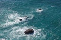 Waves breaking on rocks in sea Royalty Free Stock Photo