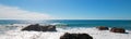 Waves breaking on rocky coastline at Cerritos Beach between Todos Santos and Cabo San Lucas in Baja California Mexico