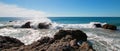 Waves breaking on rocky coastline at Cerritos Beach between Todos Santos and Cabo San Lucas in Baja California Mexico