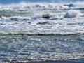 Waves breaking and rolling on beach background Royalty Free Stock Photo