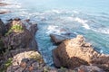 Waves clashing on a rocky shore in the morning