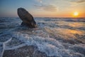 Waves, coastal rocks, dawn in the sea Royalty Free Stock Photo