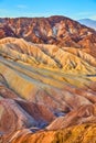 Waves of color from eroded sediment create stunning mountain formations in Death Valley