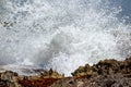 Waves crash against rocks in caribbean sea Royalty Free Stock Photo