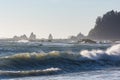 Waves crash against the rocks at sunset at Rialto Beach, Washington, US Royalty Free Stock Photo