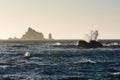 Waves crash against rocks at sunset Rialto Beach in Washington, US Royalty Free Stock Photo