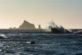 Waves crash against rocks at sunset Rialto Beach Washington, US Royalty Free Stock Photo