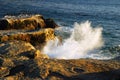 Waves crash against a rocky shore Royalty Free Stock Photo