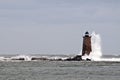 Waves Crash Arount Maine Lighthouse