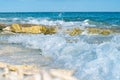 Waves break over coral shelf on edge of island splashing in air on Lady Elliot Island Royalty Free Stock Photo