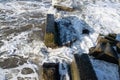 The waves crash on the old pier. The sea is stormy. Royalty Free Stock Photo