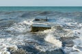 The waves crash on the old pier. The sea is stormy. Royalty Free Stock Photo