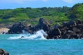 The waves crash on the rocks of peaceful coast Royalty Free Stock Photo