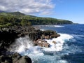 Waves crashing against basaltic rocks in Vincendo, Saint Joseph, Reunion