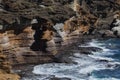 Waves crashing against a cliff Royalty Free Stock Photo