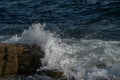 Waves crashing against rock at Schoodic Point in Maine Royalty Free Stock Photo