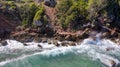 Waves Crashing Against the Rocks at Cormier Beach Haiti with Rustic Stone Steps Leading to the Water in the Background Royalty Free Stock Photo