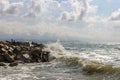 Waves crashing against rocks. Light storm. Seascape. Cloudy sky Royalty Free Stock Photo