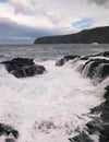 Waves crashing against rocks. Piscinas Naturais Caneiros Natural Park