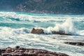 Waves crashing against the rocks in Porto Ferro shore Royalty Free Stock Photo
