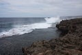 Waves crashing against rocks at the shore in Tonga Royalty Free Stock Photo