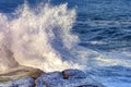 Waves crashing against rocks with water spray Royalty Free Stock Photo