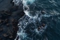 Waves crashing against a volcanic shore, view from a drone Royalty Free Stock Photo