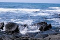 Waves crashing on the beach, basalt on Jeju Island Royalty Free Stock Photo