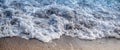 Waves crashing beach, close-up. Sea wave foams. Royalty Free Stock Photo