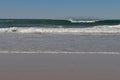 Rough sea, waves breaking on beach