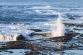 Waves crashing on the lava rock bluffs