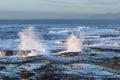 Waves crashing on the lava rock bluffs