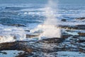 Waves crashing on the lava rock bluffs