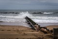 Waves crashing onto tidal defences on Aberdeen city beach on a cloudy day, Scotland, United Kingdom Royalty Free Stock Photo