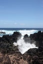 Waves crashing onto volcanic rock on the shore of Laupahoehoe Point on the Hamakua Coast, Hawaii Royalty Free Stock Photo