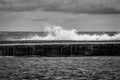 Waves crashing over a coral reef on a cloudy day. Coldness and loneliness concept Royalty Free Stock Photo