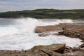 Waves Crashing Over Jagged rocks