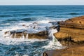 Waves Crashing Over Rock Formations at Sunset Cliffs Royalty Free Stock Photo