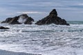Waves crashing over the sea stacks on the Pacific coast at Harris Beach State Park, Oregon, USA Royalty Free Stock Photo