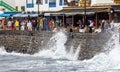 Waves crashing over the sea wall onto the promenade in Playa Blanca, Lanzarote, Spain Royalty Free Stock Photo