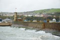 Waves crashing into pier of Whitehaven harbour in Cumbria, England, UK