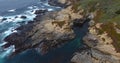 Waves crashing on rocks along California coast 4k 24fps