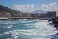 Waves crashing on rocks of San Sebastian coast, Spain. Scenic bay of Biscay in San Sebastian, Donostia. Surf concept. Royalty Free Stock Photo