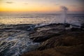 Waves crashing into the rocks surface