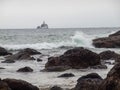 Waves Crashing on Rocks with Tillamook Lighthouse