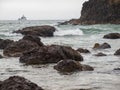 Waves Crashing on Rocks with Tillamook Lighthouse