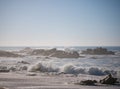 Waves crashing on rocky beach on foggy day on the coast of Portugal Royalty Free Stock Photo