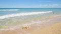 Waves crashing on the sandy beach Royalty Free Stock Photo