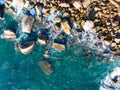 Waves crashing on seashore rocks,Top view sea surface waves background Royalty Free Stock Photo